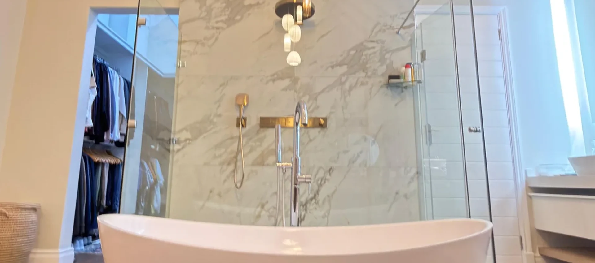 Completed luxury bathroom with freestanding bath and glass shower