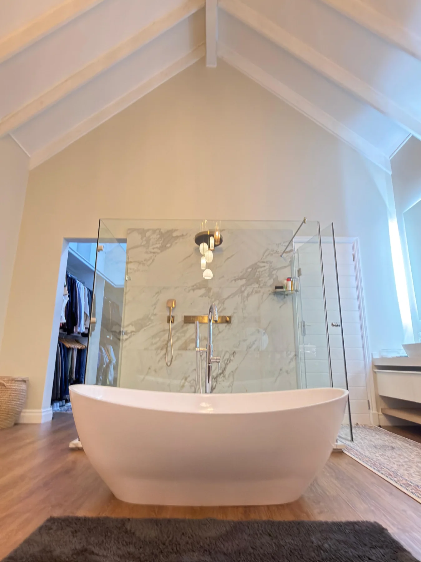 Freestanding bath and marble shower suite