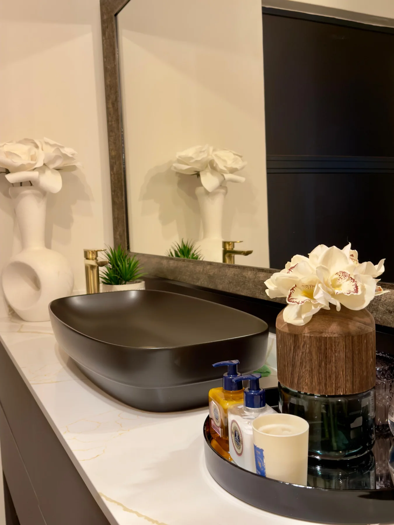 Dark basin and styled vanity detail